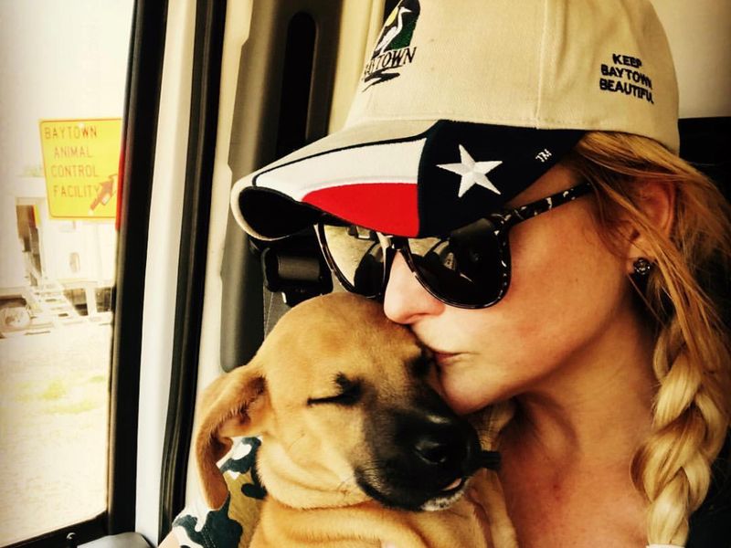 Miranda with a rescue pup shortly after Hurricane Harvey
