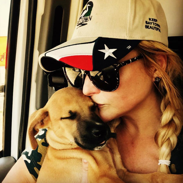 Miranda with a rescue pup shortly after Hurricane Harvey